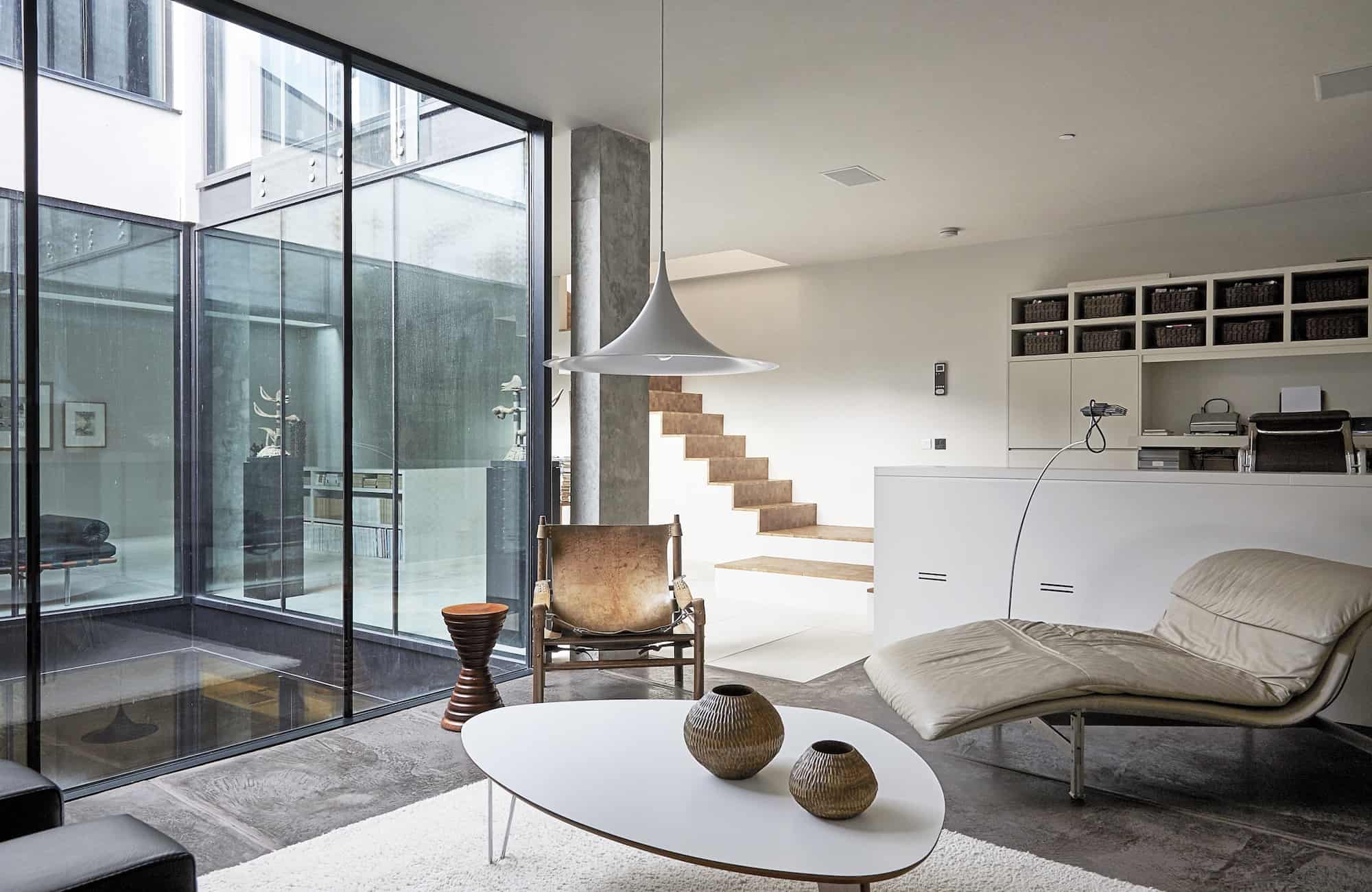 Shelter SW18 - A contemporary location house in London, built around a central courtyard with lots of glass, concrete and minimalist styling - The Location Guys
