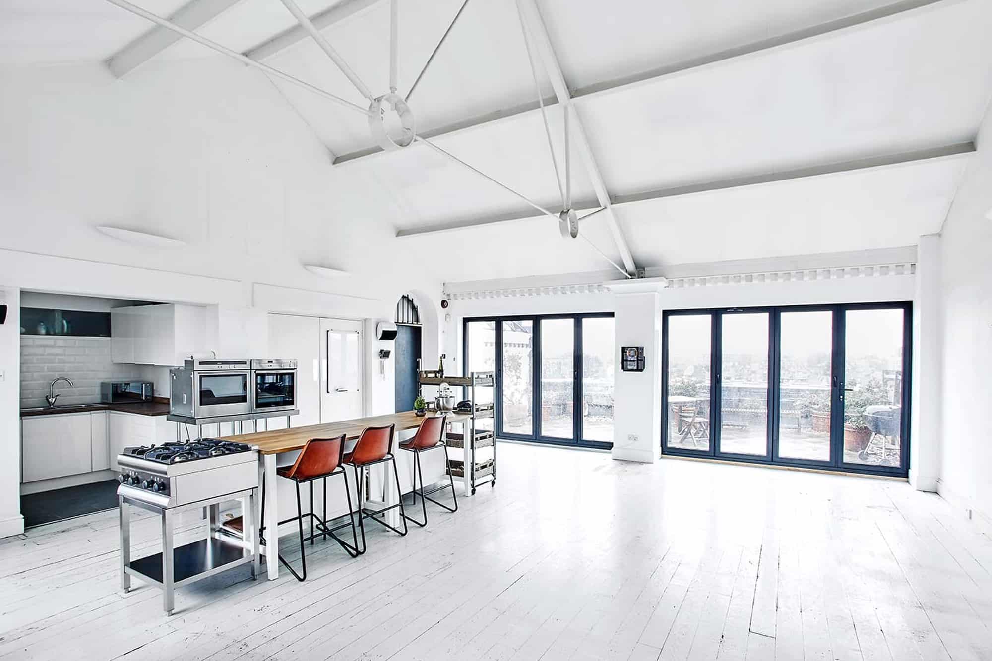 Warple Studio One W3 - white studio space with high ceiling and balcony with city views - The Location Guys
