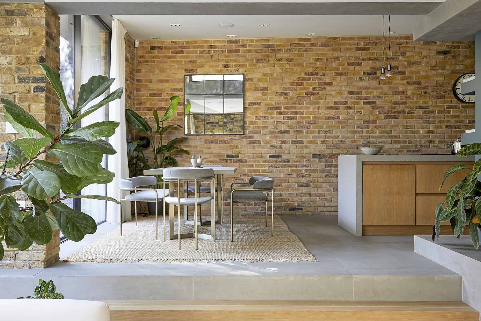 New Cross SE14 - A contemporary home with exposed brick walls, concrete elements and large expanses of glass opening to substantial garden - The Location Guys