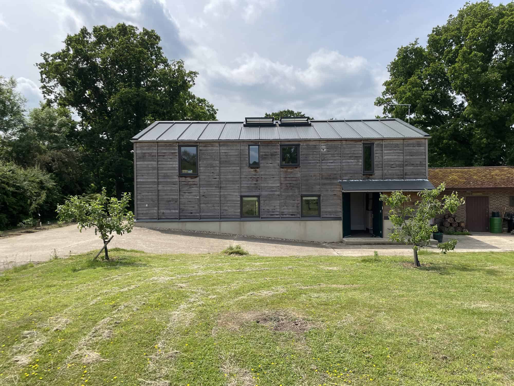 Egerton TN27 - Converted barn on 1.75 acres in Kent with exposed concrete, oak floors, vintage interiors, double-height spaces, and extensive parking - The Location Guys